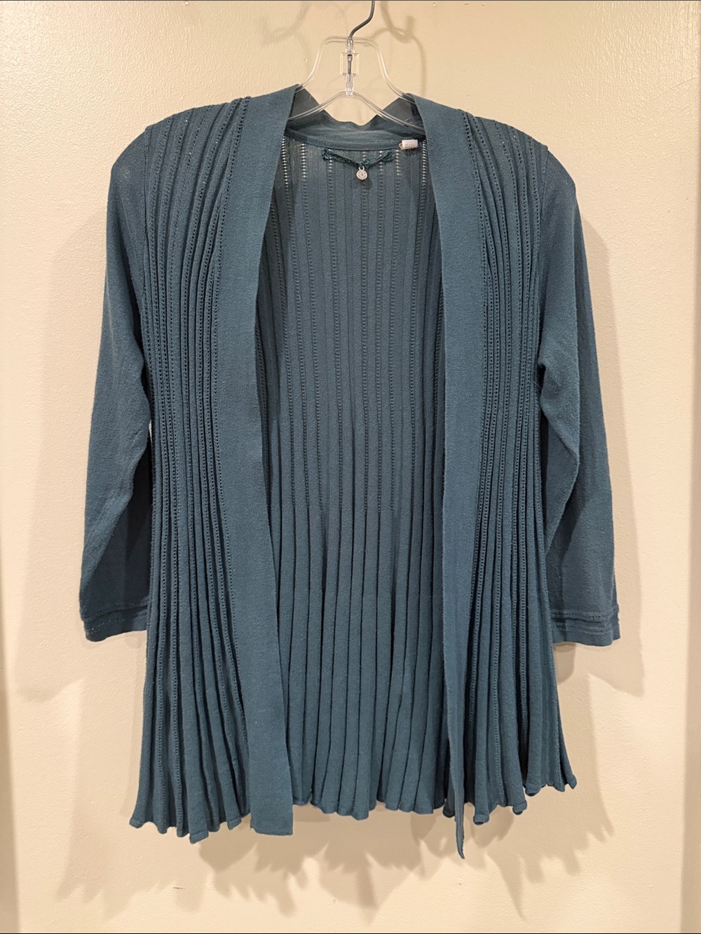 Open-Front Pleated Cardigan in dark sage green from Anthropologie